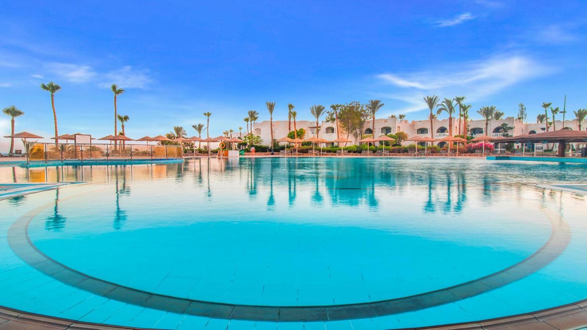 Domina coral bay resort&spa sharm el sheikh Exterior foto The swimming pool at the hotel